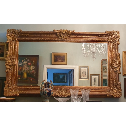 112 - An extremely large rectangular Mirror with highly carved outline and bevelled mirror glass 227 x 138... 