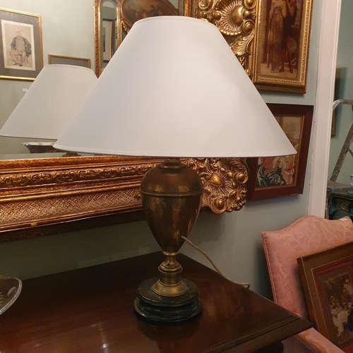 120 - A good Brass Table Lamp of bulbous form. H 42 cm approx.