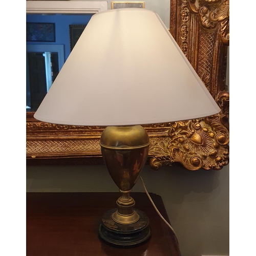 120 - A good Brass Table Lamp of bulbous form. H 42 cm approx.