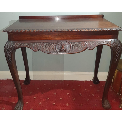 142 - A late 19th early 20th Century Mahogany Irish Mask Table with carved rope edge top and lions head ma... 