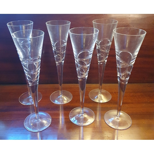 18 - A set of six John Rocha Crystal Champagne Flutes along with a set of four John Rocha red wine glasse... 