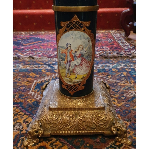 192 - An unusual 20th Century Urn Stand with a highly painted circular shaft, highly moulded and brass bas... 