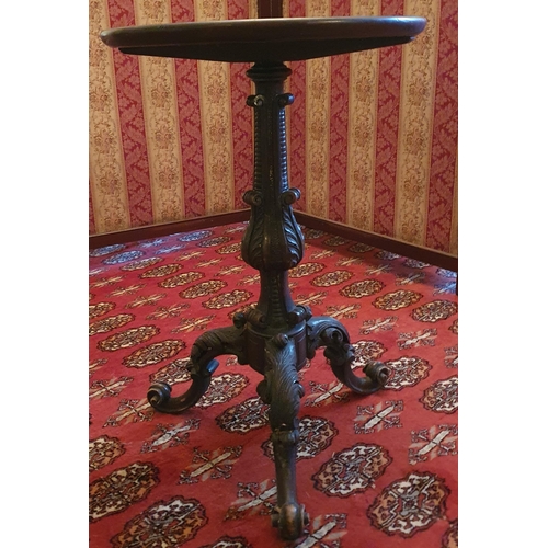 44 - A good 19th Century circular Wine Table with ribbed top and highly carved tripod support. Diam. 39 x... 