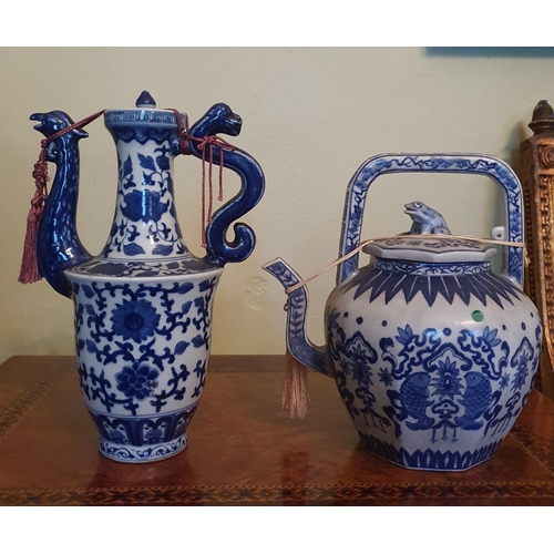 50 - A group of four blue and white Oriental Teapots.