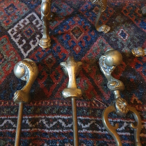57 - A 20th Century Brass Companion Set with two fire dogs.