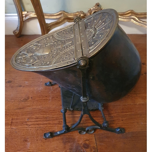 67 - A really good and unusual 19th Century Brass and Cast Iron Coal Skuttle with highly embossed Brass l... 