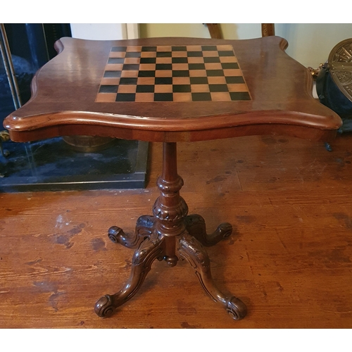 68 - A fantastic 19th Century Walnut Games Table with chessboard top on turned support and carved quatref... 