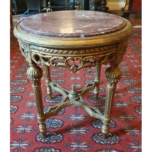 91 - A 20th Century Timber and Plaster Gilt circular Table with a rouge marble insert on turned fluted su... 