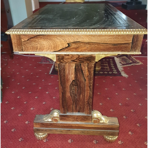 216 - A fabulous 19th Century Rosewood and Gilded Writing Table with twin frieze drawers and parcel gilt o... 