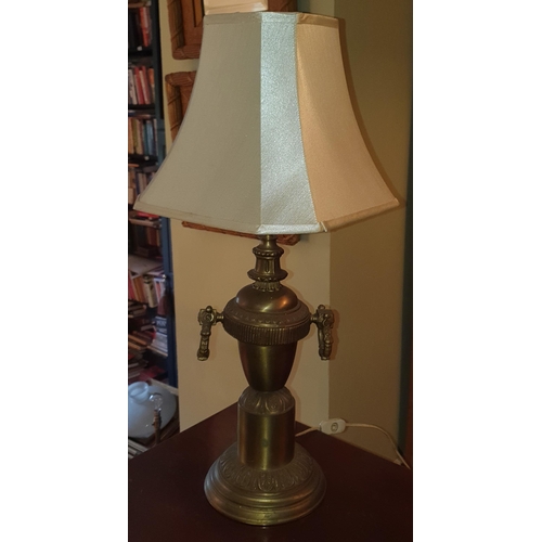 244 - A 20th Century Brass Table Lamp of circular bulbous form with shade. H 50 cm approx.