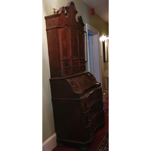 248 - A fantastic 19th Century Walnut Continental Bureau with arch top pediment and inlaid panel doors. 10... 