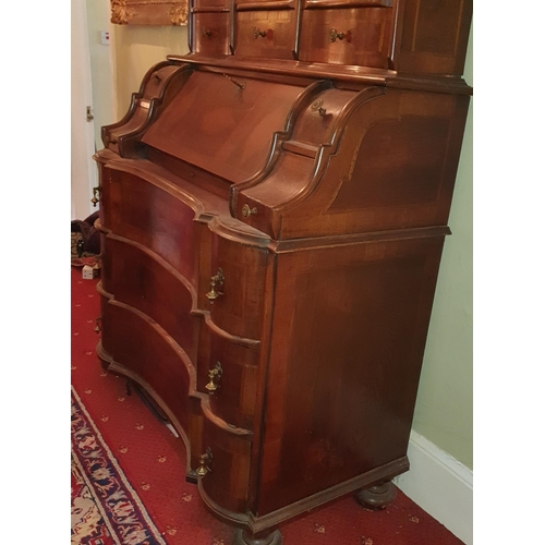 248 - A fantastic 19th Century Walnut Continental Bureau with arch top pediment and inlaid panel doors. 10... 