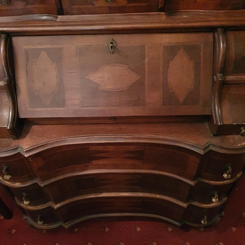 248 - A fantastic 19th Century Walnut Continental Bureau with arch top pediment and inlaid panel doors. 10... 