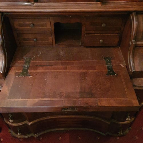 248 - A fantastic 19th Century Walnut Continental Bureau with arch top pediment and inlaid panel doors. 10... 