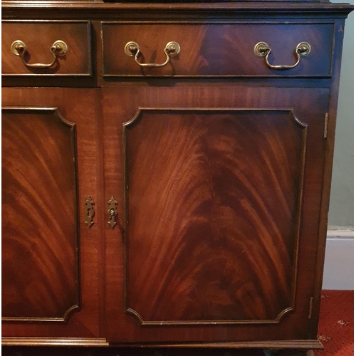 253 - A reproduction Mahogany and Veneered three door Bookcase with astragal glazed upper and triple friez... 