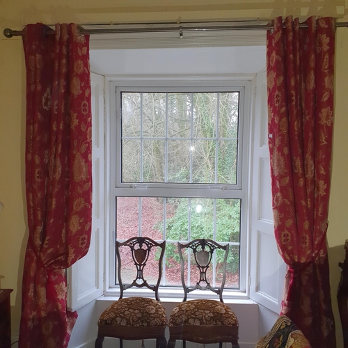 271 - A good pair of burgundy ground lined Curtains with tiebacks and silver rail. Drop 230 x 90 cm approx... 