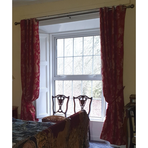 271 - A good pair of burgundy ground lined Curtains with tiebacks and silver rail. Drop 230 x 90 cm approx... 