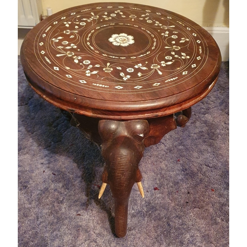 287 - A good Hardwood circular Table supported by elephants trunks with ivorine inlaid top. Diam. 53 x H 4... 