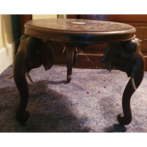 287 - A good Hardwood circular Table supported by elephants trunks with ivorine inlaid top. Diam. 53 x H 4... 