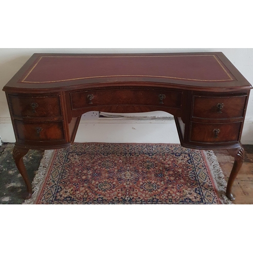 334 - A late 19th early 20th Century Mahogany concave Kneehole Desk with leather insert on carved cabriole... 