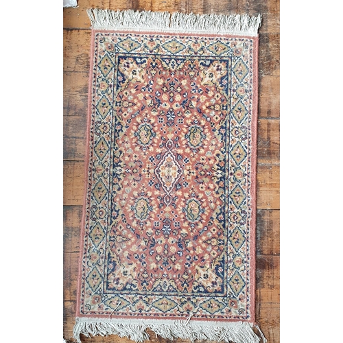 343 - A rust ground Persian style Rug. 60 x 120  cm approx.