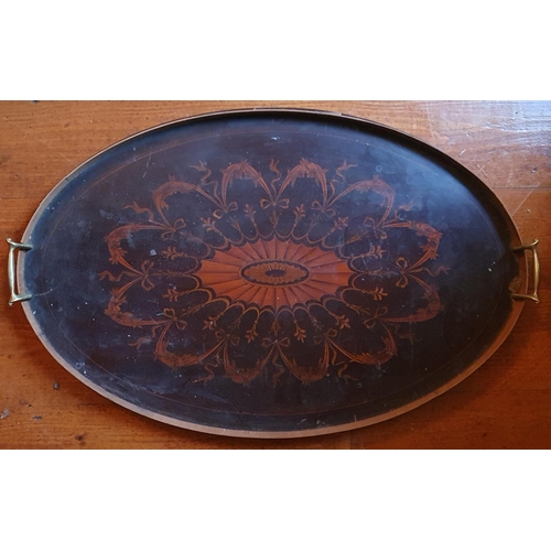 46 - An Edwardian Mahogany and Inlaid oval Tray with brass lifting handles.