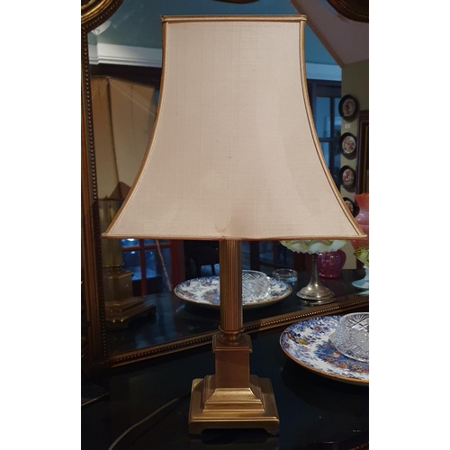 500 - A 20th Century Brass Table Lamp with shade on turned reeded columned support. H 40 cm approx.