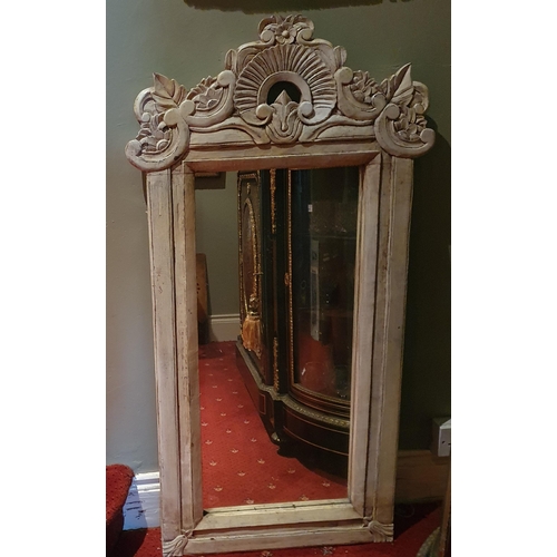 504 - A good Timber painted Mirror with highly carved outline.