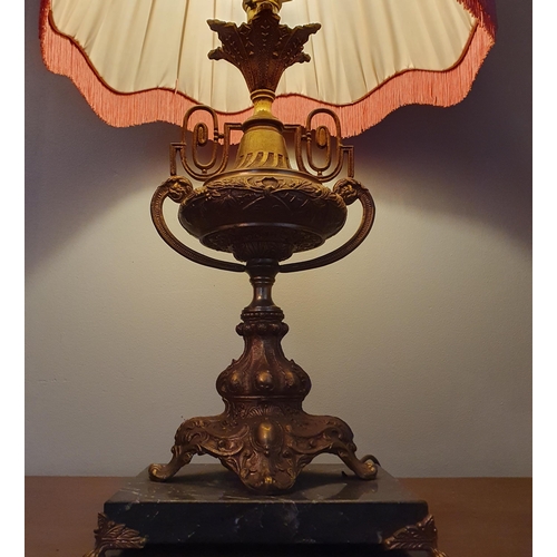 538 - A good Brass urn shaped Table Lamp on a marble base. H 46 cm approx.