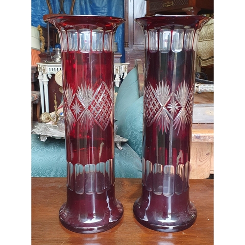 818 - Two 19th Century Cranberry Glass Vases with etched outline. (one with crack). D 14 x H 41 cm approx.