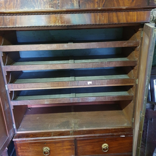 838 - A fantastic Regency Mahogany Linen Press with two short over two long with original ormolu ring hand... 