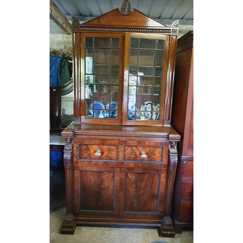 844 - A fine mahogany Secretaire Bookcase, in the Egyptian Revival style, the arched pediment with anthemi... 