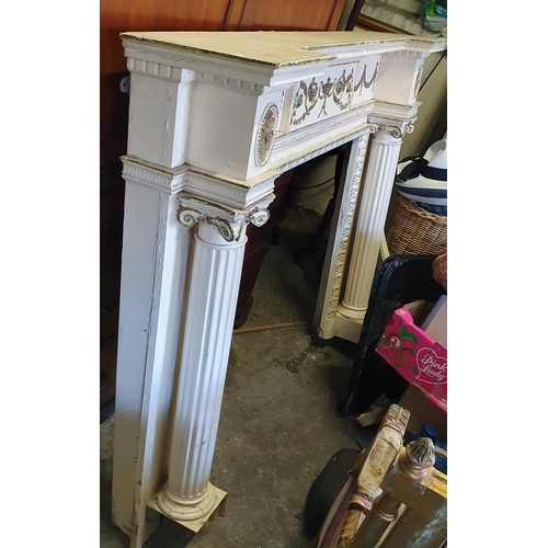 847 - An attractive painted and parcel gilt wooden Fireplace, in the Neo-Classical style of inverted break... 