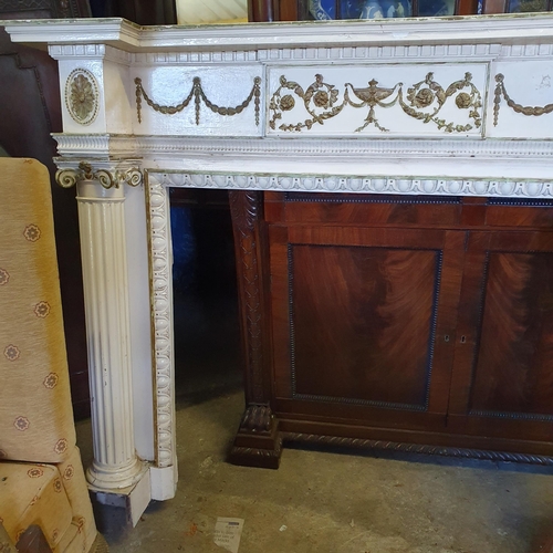 847 - An attractive painted and parcel gilt wooden Fireplace, in the Neo-Classical style of inverted break... 