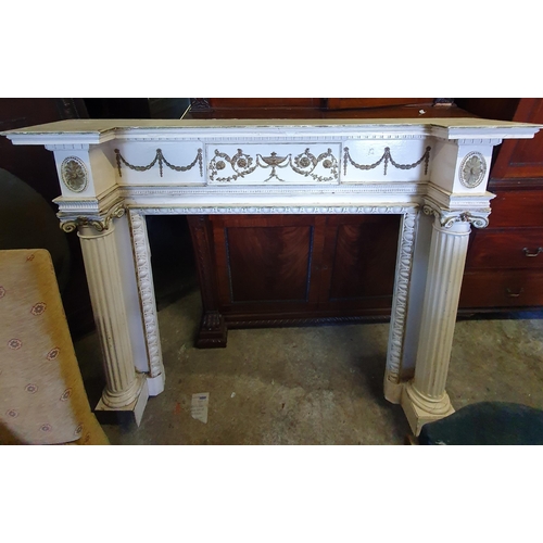 847 - An attractive painted and parcel gilt wooden Fireplace, in the Neo-Classical style of inverted break... 