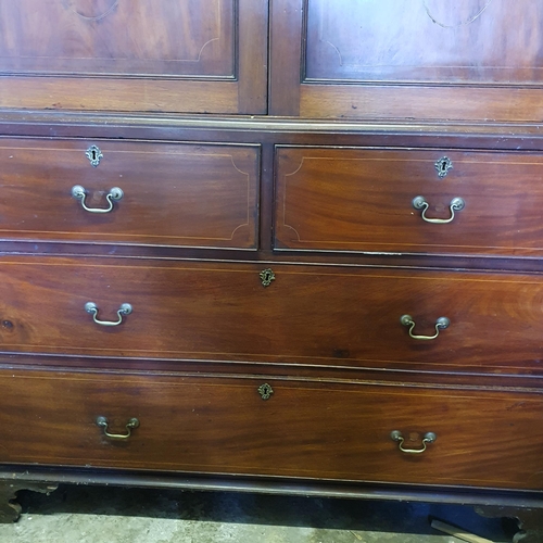 850 - A 19th Century Mahogany and Inlaid Linen Press with two short over two long drawers with elliptical ... 