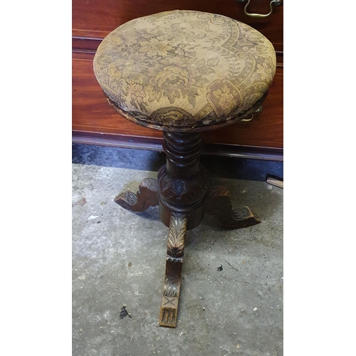 860 - A late 19th Century Mahogany rise and fall Piano Stool on tripod support. Diam. 29 x H 55 cm approx.