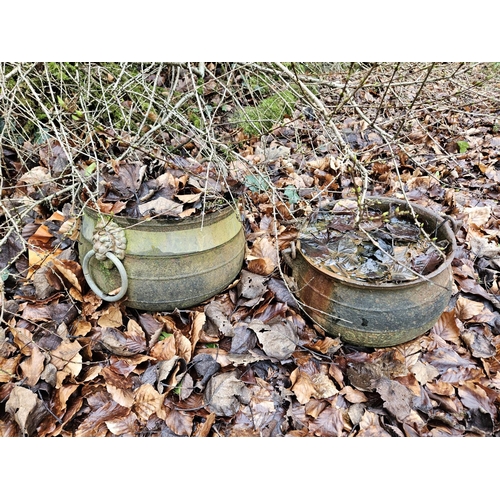 1005 - Two Cast iron Skillets along with a copper pot. D 31 x H 27, D 27 x H 21 cm approx.