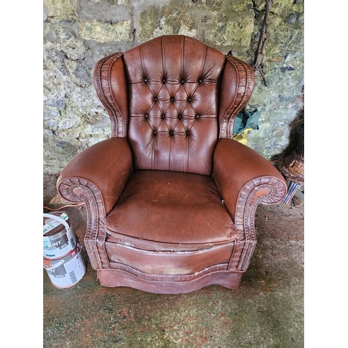 1051 - A good pair of leather effect Wingback Armchairs.