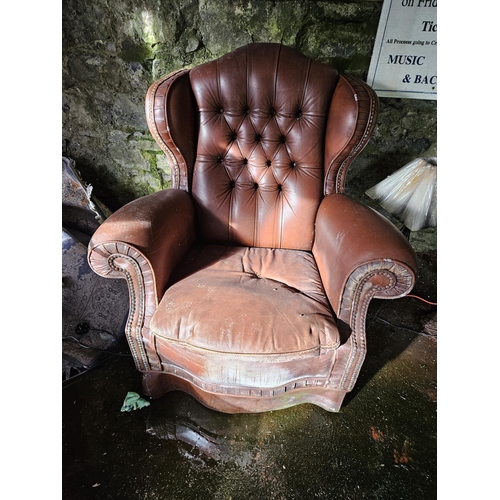 1051 - A good pair of leather effect Wingback Armchairs.