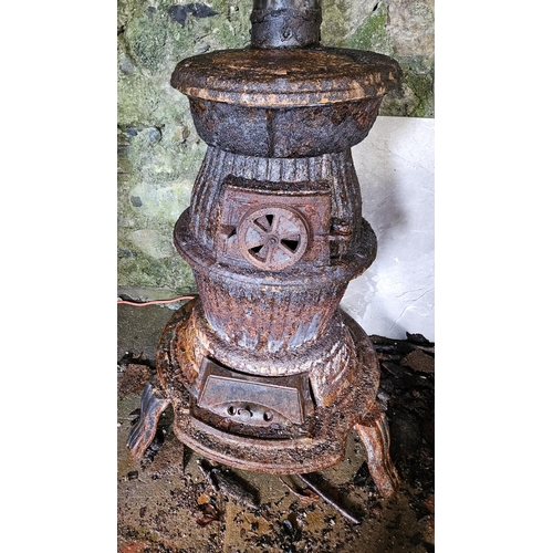 1058 - A Cast Iron pot belly Stove.