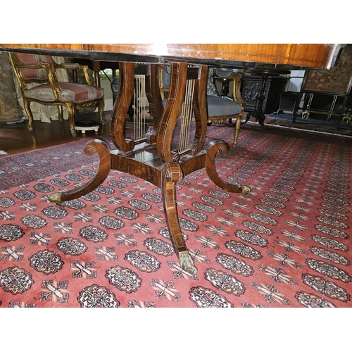 109 - A good Regency Rosewood Veneered and Crossbanded circular Centre Table on a platform quatrefoil base... 