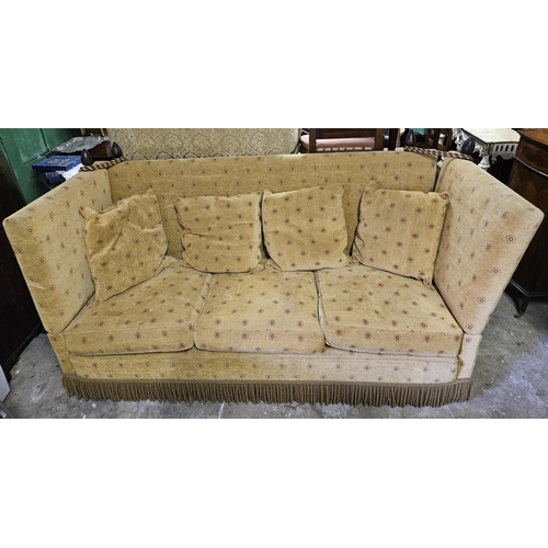 800 - A large Knole three seater Couch with fall flap arms and tiebacks. W 213 x D 80 x H 105 cm approx.