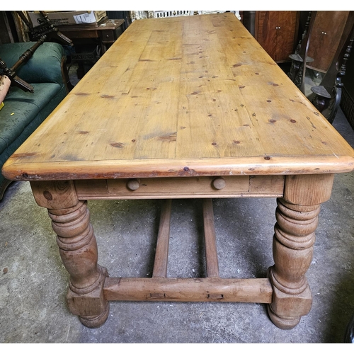 805 - An extremely large Pine Kitchen Table with single frieze drawer on large bulbous turned supports and... 