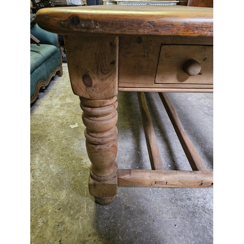 805 - An extremely large Pine Kitchen Table with single frieze drawer on large bulbous turned supports and... 