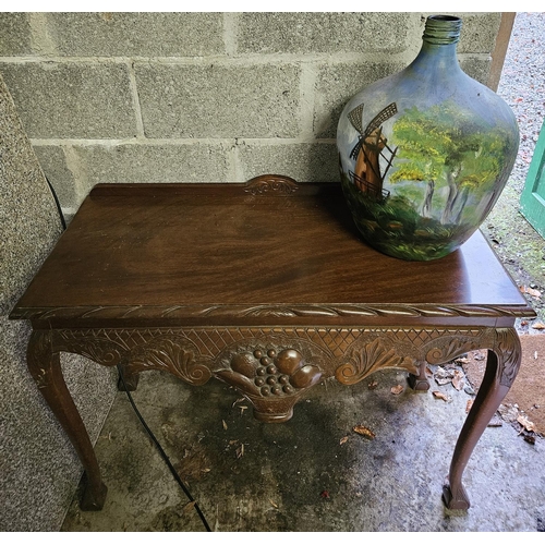 813 - A Modern Mahogany side Table with a highly carved freeze 108w x 41d x 75h not gallery cm approx.