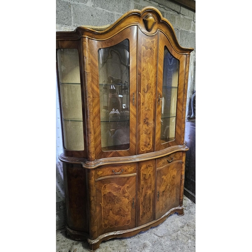 814 - A large Walnut and veneered bow fronted display Cabinet with glazed top and paneled base 226h x 50d ... 