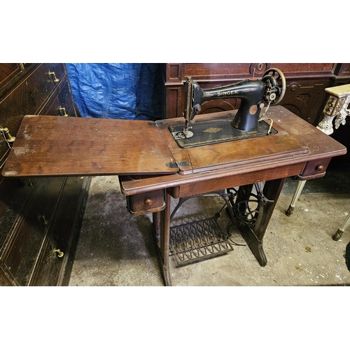 832 - A vintage Singer Sewing Machine with treadle base. 87 x 41 x H 74 cm approx.