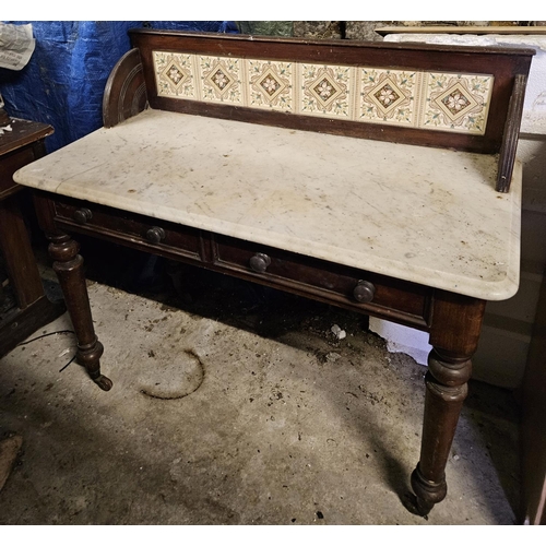 843 - A late 19th Century Mahogany Washstand with twin frieze drawers and marble top. 106 x 50 cm approx.