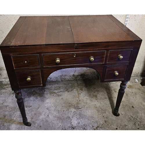 857 - A Georgian Mahogany Gentleman's Vanity Unit with lift up top, mirrored centre, on turned supports an... 